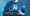 A torso of a man wearing a blue long sleeve top holding a small tablet with the transparent words generative AI floating above it